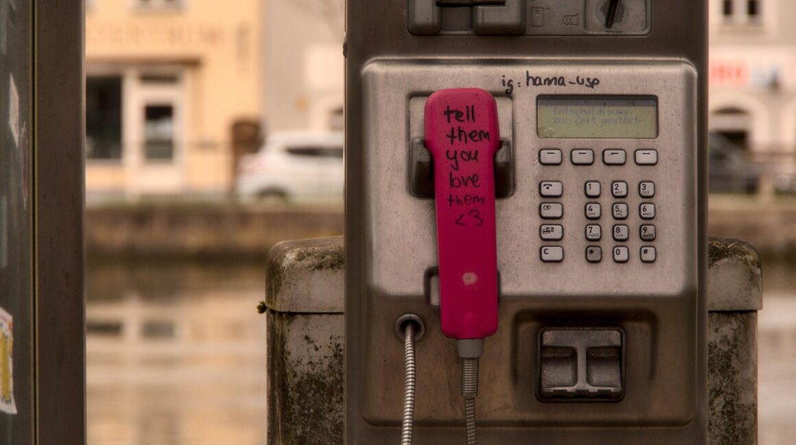 Phone booth reminding you to tell someone you love them