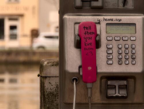 Phone booth reminding you to tell someone you love them